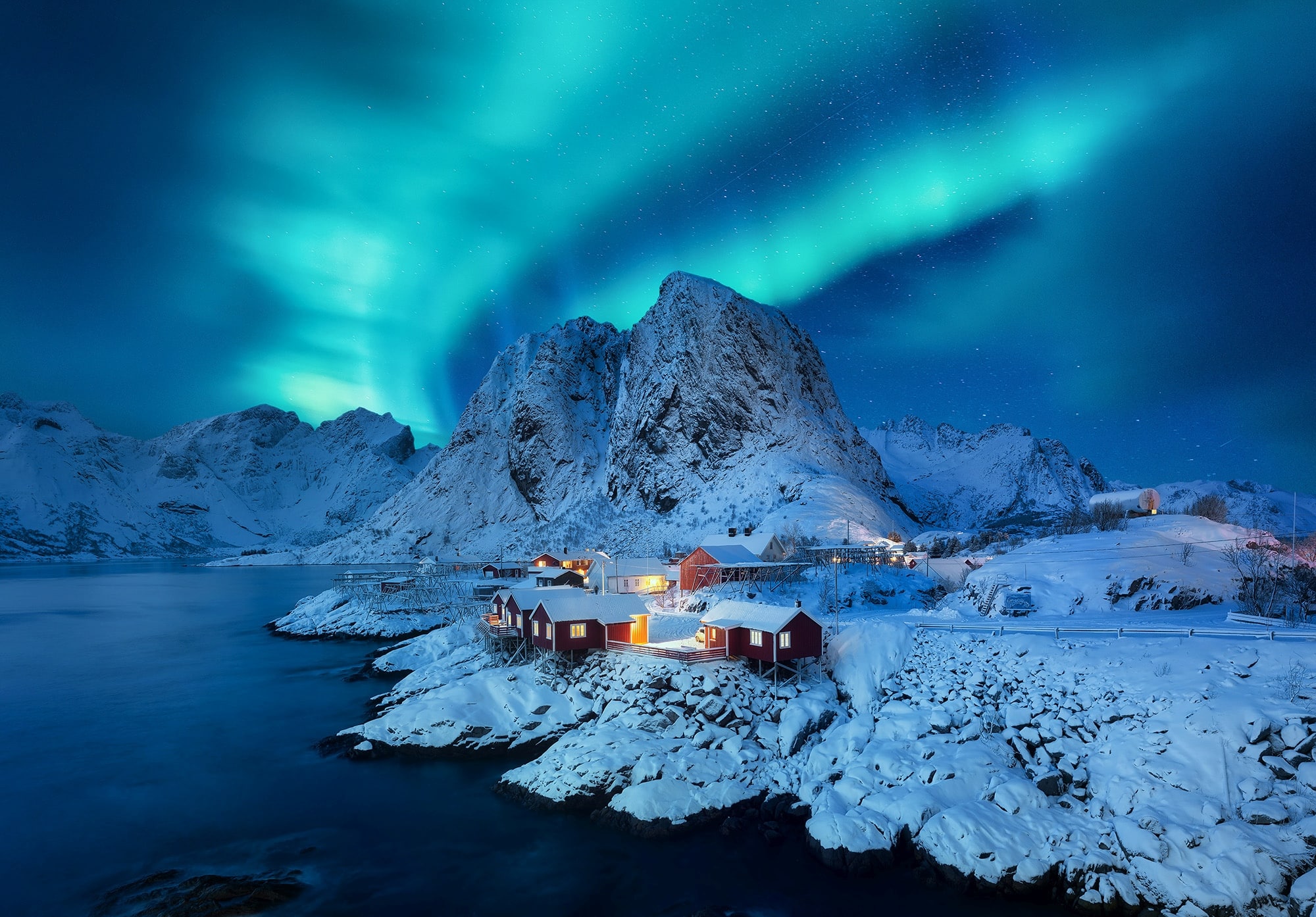 Aurora Borealis, Lofoten islands, Norway. View on the houses in the Hamnoy village, Lofoten Islands, Norway. Iconic view in Norway. High resolution photo.